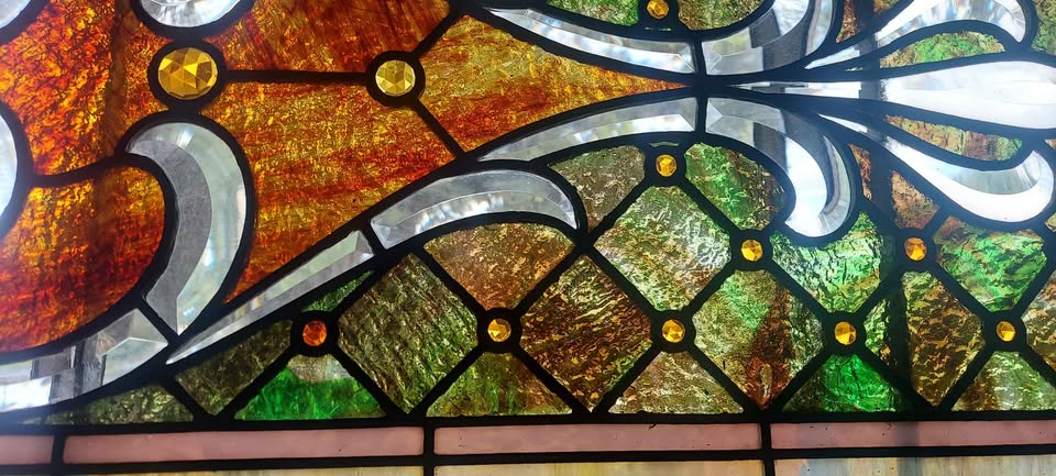 Antique stained glass transom-light window