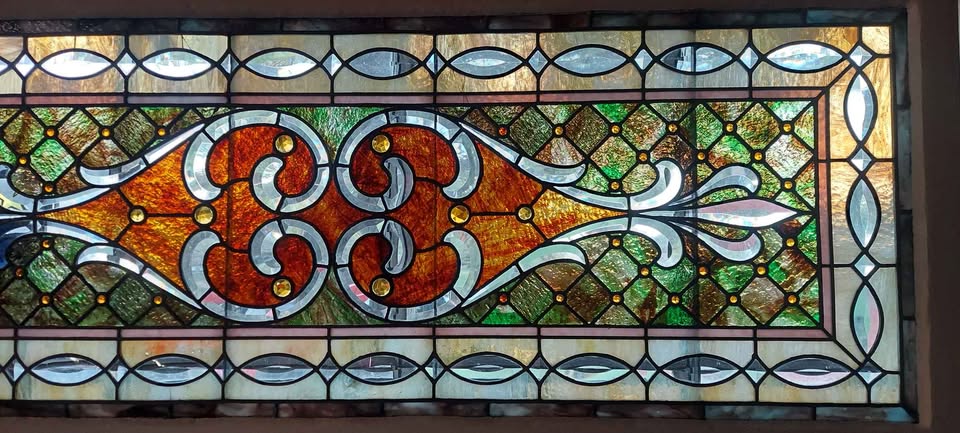 Antique stained glass transom-light window
