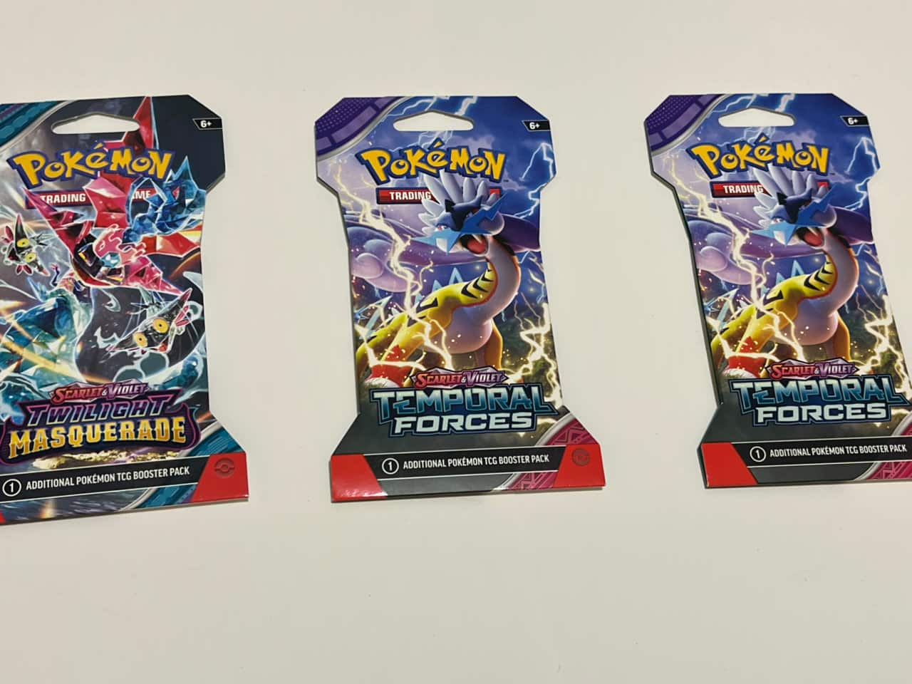 Pokémon Trading Card Game booster packs from the Scarlet & Violet series: Temporal Forces and Twilight Masquerade.