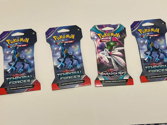 Pokémon Trading Card Game booster packs from the Scarlet & Violet series: Temporal Forces and Twilight Masquerade.