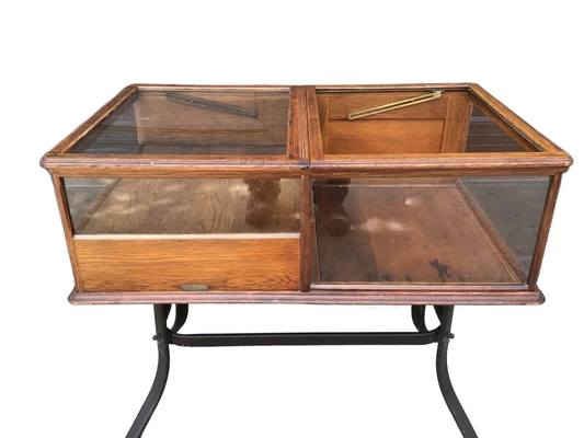 Display cabinet with coin drawer