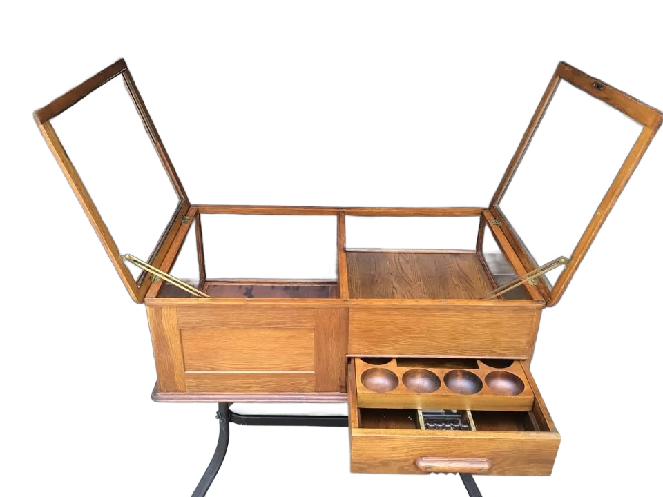 Display cabinet with coin drawer
