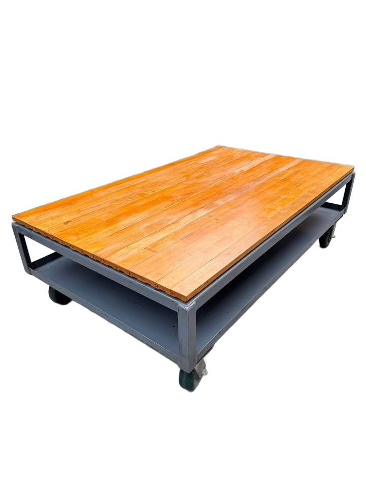 Extra large industrial-style coffee table with solid wood top and gray metal base on wheels